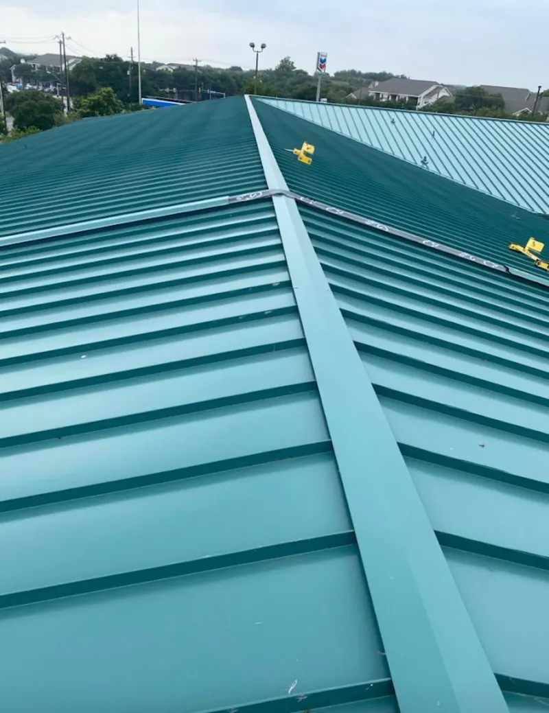 Green commercial metal roof ridge and valley for Metal Roof Repair in New Gloucester